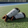 Canillera Hockey Césped Juvenil Adulto Anatomic Naranja